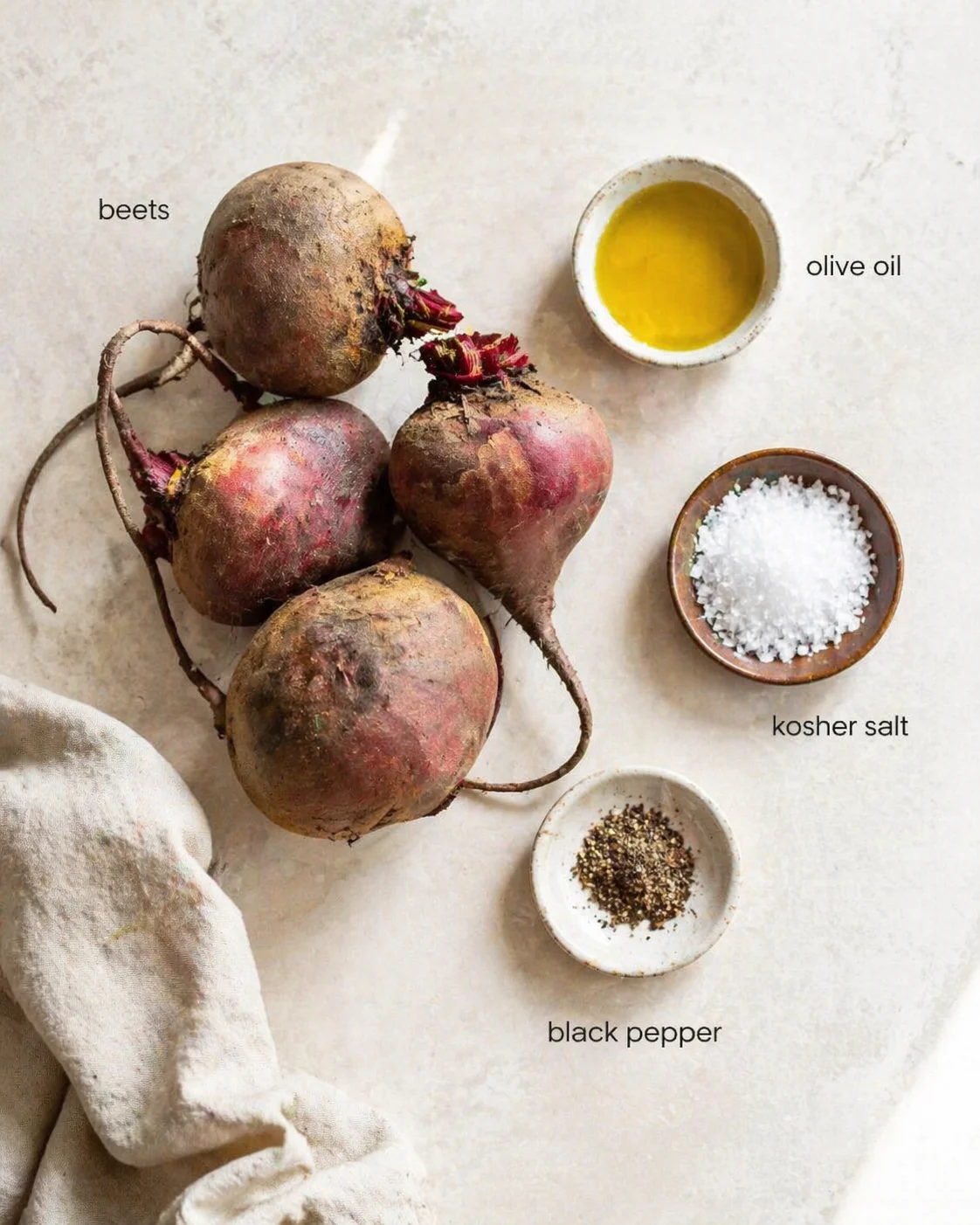 overhead view of beets with labels for olive oil, kosher salt, and black pepper