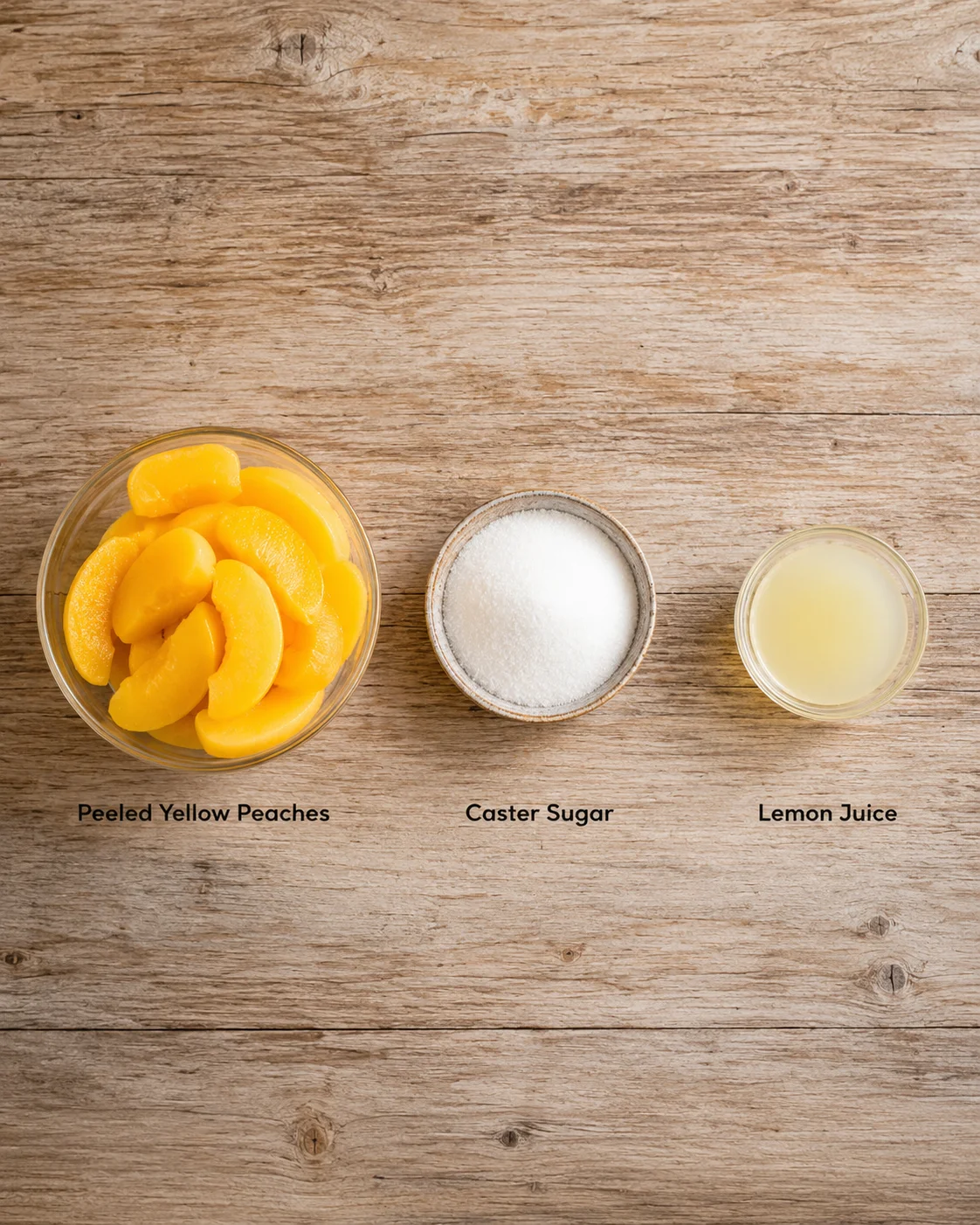 Peach Sorbet Without Ice Cream Maker Bowls of fresh yellow peaches, sugar, and lemon juice for sorbet preparation.